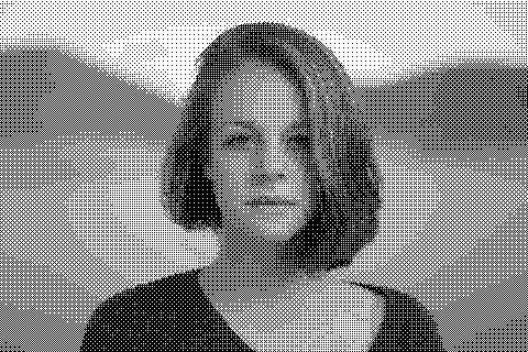 A red-haired person is pictured beside a lake with distant wooded hills behind them. Dithered grayscale treatment.